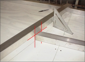 Affordaplane square tube marked with a speed square for cutting